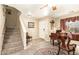 Inviting living room featuring a staircase, tiled floors and natural light at 11163 W Edgemont Ave, Avondale, AZ 85392