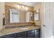 Bathroom with granite countertop, single sink, and mosaic mirror at 11333 N 92Nd St # 2035, Scottsdale, AZ 85260