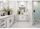 Modern bathroom with double vanity and a walk-in shower at 11585 N 108Th Way, Scottsdale, AZ 85259