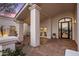 Elegant entryway with courtyard and fountain features at 11585 N 108Th Way, Scottsdale, AZ 85259