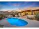 Luxury pool and spa with mountain views at sunset at 12174 N 120Th St, Scottsdale, AZ 85259