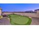 Putting green in backyard with patio furniture at 13133 W Crestvale Dr, Peoria, AZ 85383