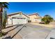 Two-story house with a two-car garage and desert landscaping at 15990 N 90Th Ave, Peoria, AZ 85382