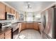 Modern kitchen featuring stainless steel appliances and ample cabinet space at 15990 N 90Th Ave, Peoria, AZ 85382