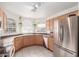Bright kitchen features ample cabinetry and stainless steel appliances at 15990 N 90Th Ave, Peoria, AZ 85382