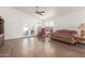 Living room with hardwood floors, sliding doors, and a cozy atmosphere at 15990 N 90Th Ave, Peoria, AZ 85382