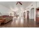 Spacious living room with hardwood floors and a view of the kitchen at 15990 N 90Th Ave, Peoria, AZ 85382