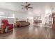 Bright living room featuring hardwood floors and comfy seating at 15990 N 90Th Ave, Peoria, AZ 85382