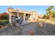 Relaxing backyard with patio, seating area, and desert landscaping at 19751 N Desert Song Way, Surprise, AZ 85374