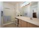 Bright bathroom with a double vanity and walk-in shower at 19751 N Desert Song Way, Surprise, AZ 85374