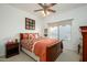 Cozy bedroom with a wooden sleigh bed and window seating at 19751 N Desert Song Way, Surprise, AZ 85374