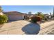 Front view of house, showing garage and driveway at 19751 N Desert Song Way, Surprise, AZ 85374