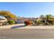 Single-story home with desert landscaping and two-car garage at 19751 N Desert Song Way, Surprise, AZ 85374
