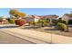 Landscaped front yard with colorful flowers and gravel at 19751 N Desert Song Way, Surprise, AZ 85374