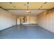 Attached garage with extra storage cabinets and space for two cars at 19751 N Desert Song Way, Surprise, AZ 85374