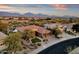 Aerial view of house in a community with mountain views and a golf course at 19771 N 84Th Way, Scottsdale, AZ 85255