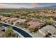 Aerial view showcasing a stunning property with mountain views and golf course access at 19771 N 84Th Way, Scottsdale, AZ 85255