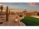 Landscaped backyard with artificial turf and cactus at 19771 N 84Th Way, Scottsdale, AZ 85255