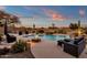 Backyard oasis with pool, fire pit, and patio furniture at 19771 N 84Th Way, Scottsdale, AZ 85255