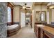 Spa-like bathroom with soaking tub, walk-in shower, and double vanity at 19771 N 84Th Way, Scottsdale, AZ 85255