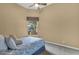 Bright bedroom with leafy patterned bedding and a view at 19771 N 84Th Way, Scottsdale, AZ 85255
