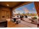Covered patio with outdoor dining set and views of the pool at 19771 N 84Th Way, Scottsdale, AZ 85255