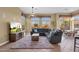 Relaxing Gathering room with sectional sofa and large TV at 19771 N 84Th Way, Scottsdale, AZ 85255
