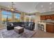 Gathering room boasts a sectional sofa and adjacent kitchen at 19771 N 84Th Way, Scottsdale, AZ 85255