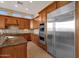 Well-equipped kitchen with double oven and large fridge at 19771 N 84Th Way, Scottsdale, AZ 85255