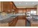 Modern kitchen with granite countertops and stainless steel appliances at 19771 N 84Th Way, Scottsdale, AZ 85255