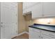 Laundry room with cabinets and countertop at 19771 N 84Th Way, Scottsdale, AZ 85255