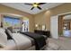 Bedroom with scenic views of the pool area, cozy seating area and private exterior access at 19771 N 84Th Way, Scottsdale, AZ 85255