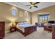 Spacious main bedroom with a king-size bed and ample natural light at 19771 N 84Th Way, Scottsdale, AZ 85255