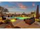 Relaxing pool and patio area with comfortable seating and mountain views at 19771 N 84Th Way, Scottsdale, AZ 85255