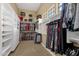 Large walk-in closet with ample shelving and hanging space at 19771 N 84Th Way, Scottsdale, AZ 85255