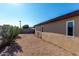 Side yard view with gravel and small plants at 1983 E Don Carlos Ave, Tempe, AZ 85281