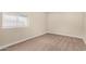 Small bedroom with window and carpet flooring at 1983 E Don Carlos Ave, Tempe, AZ 85281