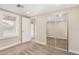 Bedroom with mirrored closet doors and access to exterior at 1983 E Don Carlos Ave, Tempe, AZ 85281