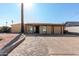 Cute single story home with a paved driveway and landscaped yard at 1983 E Don Carlos Ave, Tempe, AZ 85281