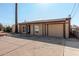 Single story home with a paved driveway and attached garage at 1983 E Don Carlos Ave, Tempe, AZ 85281