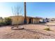 Single story home with a small front yard and mature tree at 1983 E Don Carlos Ave, Tempe, AZ 85281
