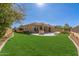 Large backyard with lush lawn and patio area at 22318 N 36Th St, Phoenix, AZ 85050
