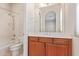 Clean bathroom with wood cabinets and a bathtub at 22318 N 36Th St, Phoenix, AZ 85050