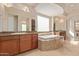Large bathroom with soaking tub, double sinks, and separate shower at 22318 N 36Th St, Phoenix, AZ 85050