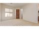 Spacious bedroom with wood door and carpet flooring at 22318 N 36Th St, Phoenix, AZ 85050