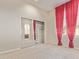 Spacious bedroom with mirrored closet and red curtains at 22318 N 36Th St, Phoenix, AZ 85050