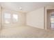 Well-lit bedroom with neutral decor and carpet flooring at 22318 N 36Th St, Phoenix, AZ 85050