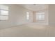 Spacious bedroom with neutral carpeting and large windows at 22318 N 36Th St, Phoenix, AZ 85050
