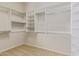 Walk-in closet with custom built-in shelving at 22318 N 36Th St, Phoenix, AZ 85050