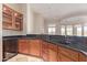Kitchen features dark wood cabinets, granite counters, and a wine cooler at 22318 N 36Th St, Phoenix, AZ 85050